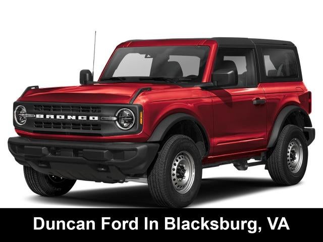 2026 Ford Bronco Base in Ruby Red Metallic Tinted Clearcoat — front three-quarter view