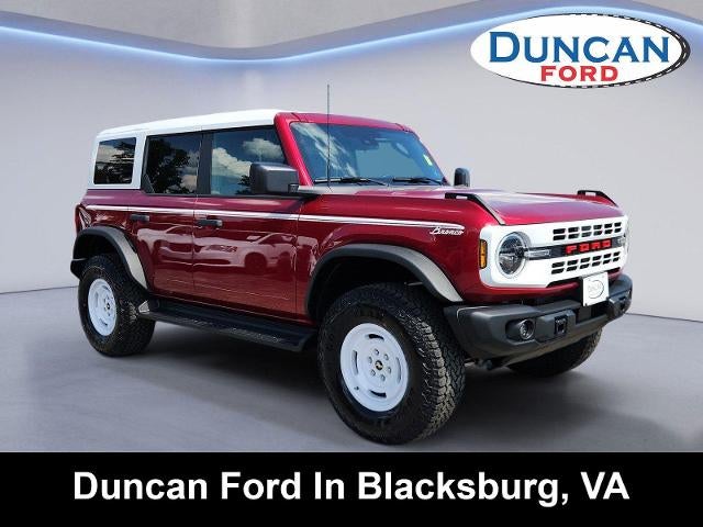 2026 Ford Bronco Heritage Edition in Ruby Red Metallic Tinted Clearcoat — front three-quarter view