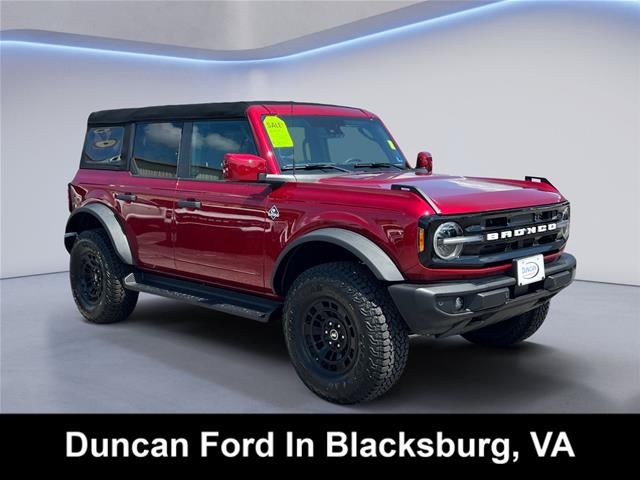 2026 Ford Bronco Outer Banks in Ruby Red Metallic Tinted Clearcoat — front three-quarter view