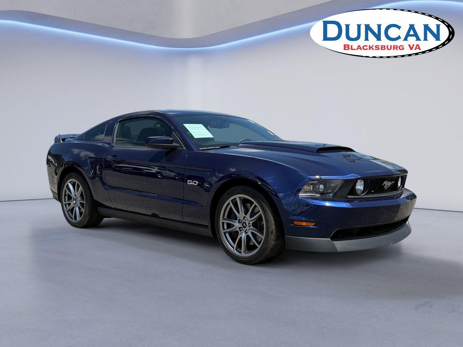 2011 Ford Mustang GT Premium in Kona Blue Metallic — front three-quarter view