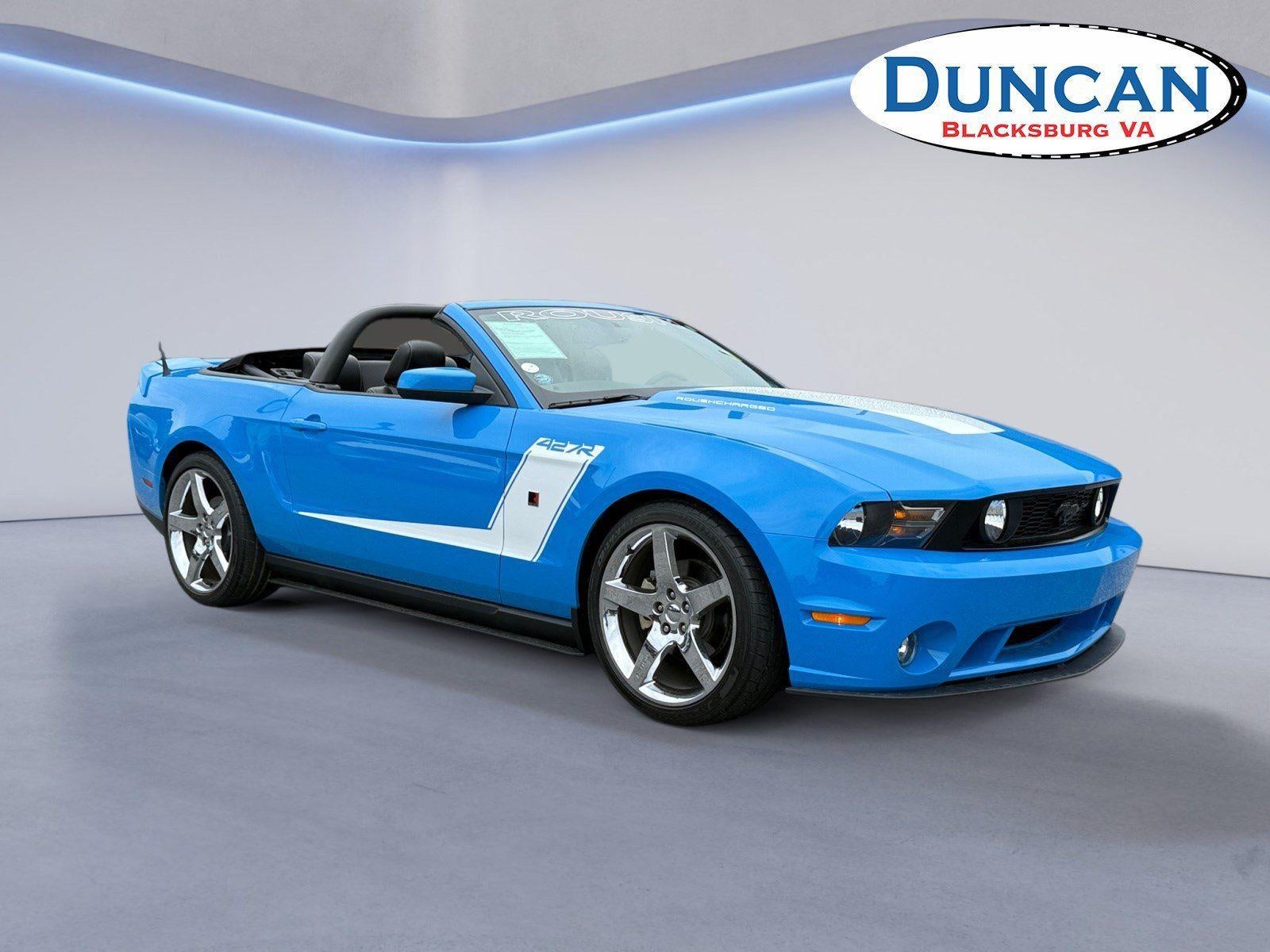 2010 Ford Mustang GT in Kona Blue Metallic — front three-quarter view