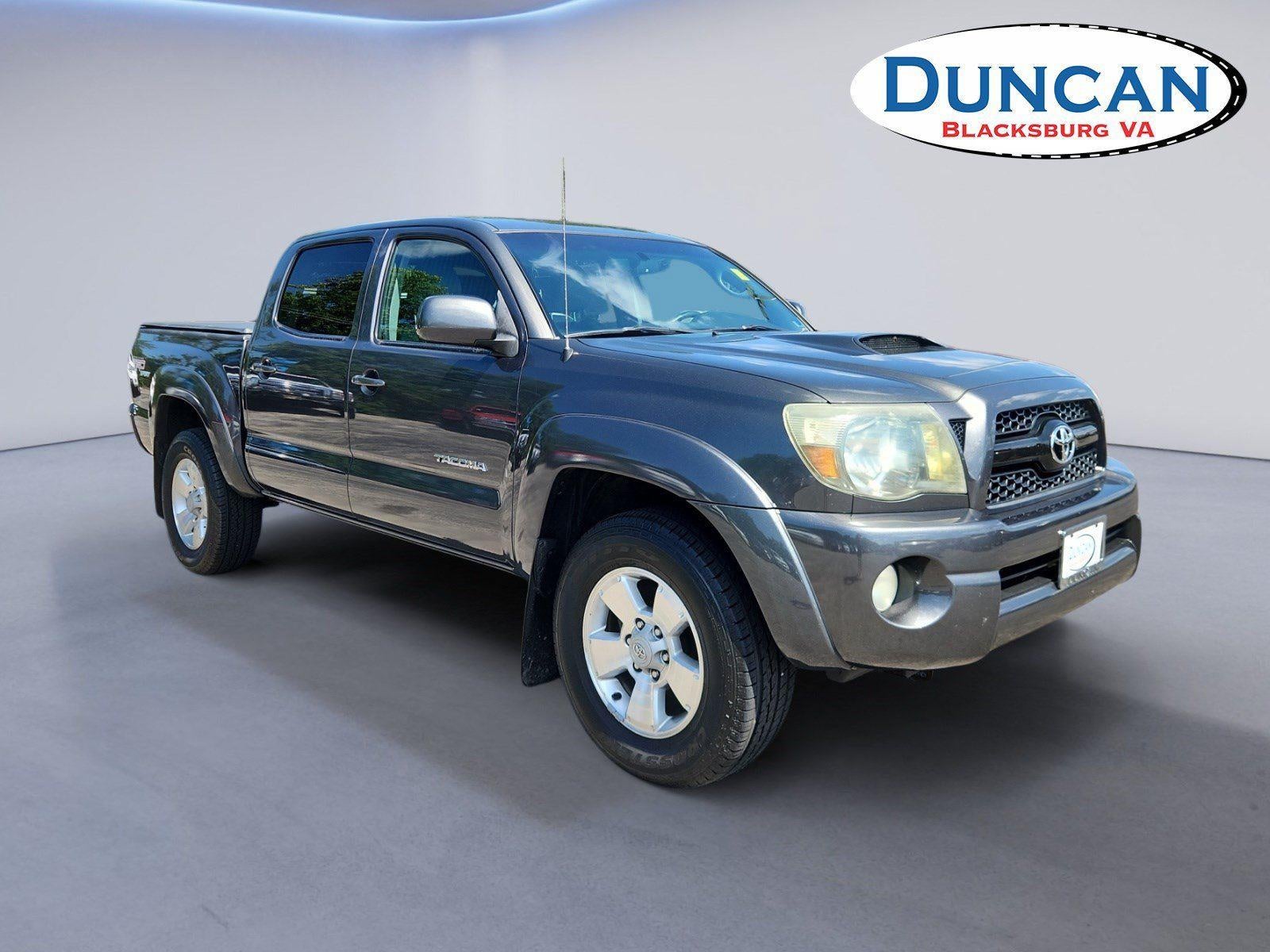 2011 Toyota Tacoma DOUBCAB in Magnetic Gray Metallic — front three-quarter view