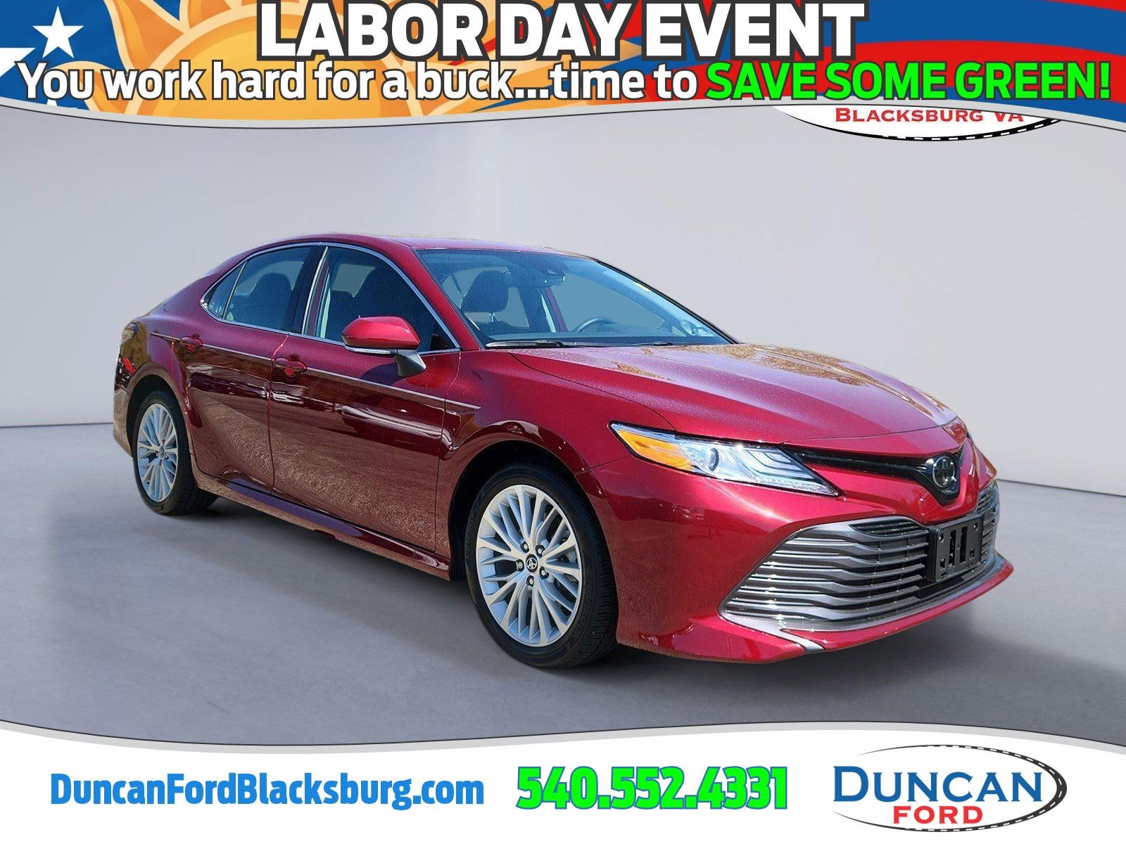 2019 Toyota Camry XLE in Ruby Flare Pearl — front three-quarter view