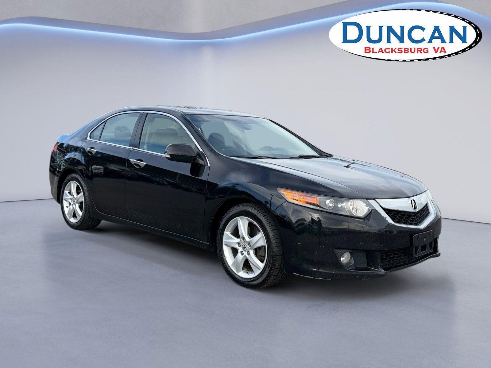 2010 Acura TSX Base in Crystal Black Pearl — front three-quarter view
